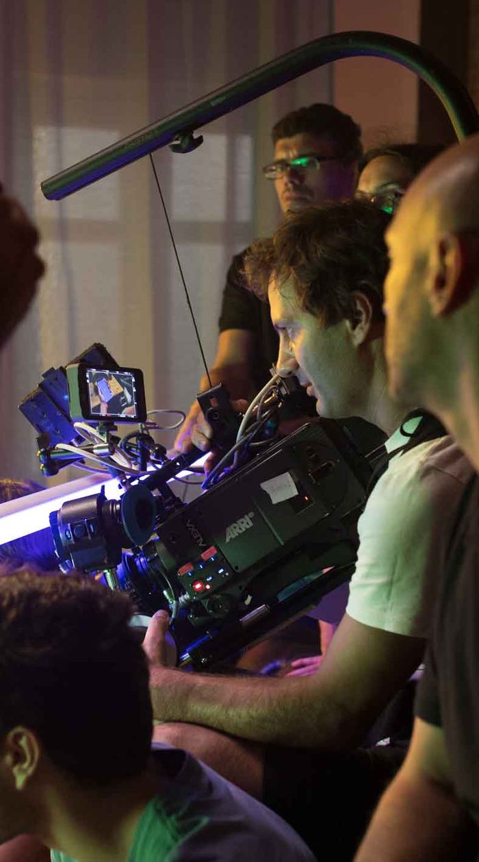 Equipa de câmara e boom no set